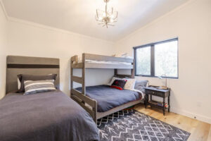 large bedroom in basement with queen/twin bunk bed