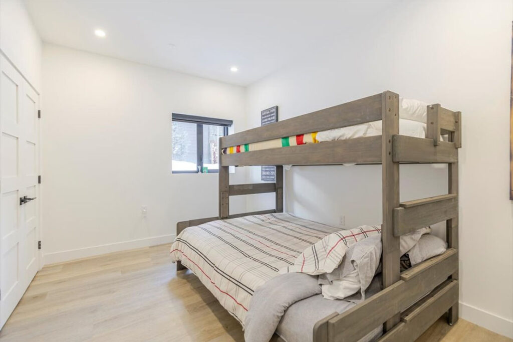 large bedroom 5 in basement with queen/twin bunk bed