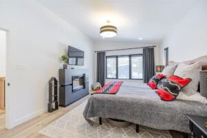 owners suite with electric fireplace